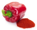 Pile of ground paprika with pepper on white background Royalty Free Stock Photo