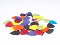 A pile of guitar picks isolated in white background with space for text Royalty Free Stock Photo