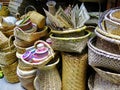 A pile of handmade woven baskets made from fiber