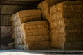 A pile of hay in a barn