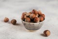 Pile of hazelnuts filbert in a bowl on a white background Royalty Free Stock Photo