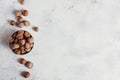 Pile of hazelnuts filbert in a bowl on a white background. Fresh nuts in their shells. Royalty Free Stock Photo