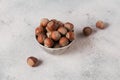 Pile of hazelnuts filbert in a bowl on a white background Royalty Free Stock Photo