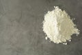 Pile or heap of rice flour isolated ondark background. Gluten free flour. Healthy food Royalty Free Stock Photo