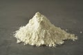 Pile or heap of rice flour isolated ondark background. Gluten free flour. Healthy food Royalty Free Stock Photo