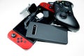 Pile of hi tech devices,console gaming, xbox controller,smartphone,addiction