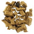 Pile of homemade rye bread croutons isolated on white background top view. Crispy bread cubes, dry rye crumbs, rusks, crouton or