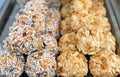 Pile of homemade sweets. Peanuts and coconut balls closeup. Royalty Free Stock Photo