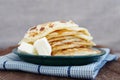 Pile of the house prepared pancakes in a green plate