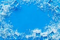 Pile of ice cubes frame on blue bar desk background top view mock up Royalty Free Stock Photo