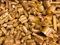 A pile of industrial scrap - brass turning leftovers and cutt off waste - waiting for recycle. Royalty Free Stock Photo
