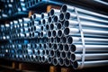 Stacks of industrial steel pipes in factory