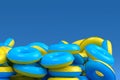 Pile of inflatable ring for swimming pool isolated on blue background