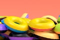 Pile of inflatable ring for swimming pool isolated on pink background