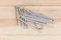 Pile of iron nail on old wooden floor Royalty Free Stock Photo
