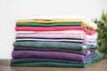 Pile of ironed clothes on table Royalty Free Stock Photo