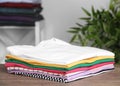 Pile of ironed clothes on table Royalty Free Stock Photo