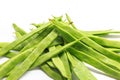 Pile of italian flat green beans on a white background