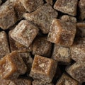 Pile of jaggery, cube shaped unrefined sugar