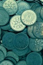 A pile of Japanese 1 one yen coins in close-up. Dark green and yellow illustration. Tinted vertical pattern on the theme of Royalty Free Stock Photo