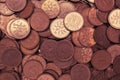 A pile of Japanese 1 one yen coins in close-up. Dark red and yellow tinted background or wallpaper. Backdrop on the business and Royalty Free Stock Photo