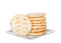 Japanese rice crackers stacked on square plate isolated on white background Royalty Free Stock Photo