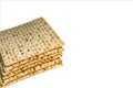 Pile of Jewish Matzah bread, substitute for bread on the Jewish Passover holiday. Pesach matzo on white background Royalty Free Stock Photo