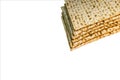 Pile of Jewish Matzah bread, substitute for bread on the Jewish Passover holiday. Pesach matzo on white background Royalty Free Stock Photo
