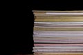 Pile of journals in front of black background. Royalty Free Stock Photo