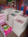 Pile of 25 kg and 5 kg rice, on the market.