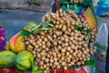Pile of langsat fruits on street market