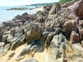 A Pile Of Large, Pointed Rock Formations, On The Edge Of The Ocean Royalty Free Stock Photo