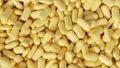 Pile of light yellow tablets or drug pills background. medicine, pharmaceutical, pharmacy