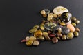 Pile of little decorative stones painted with Om symbol Royalty Free Stock Photo