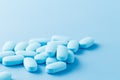 Pile of little oval blue pills Royalty Free Stock Photo