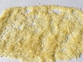 A pile of long rice grains, golden colour rice, background rice