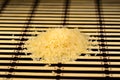Pile of the steamed rice on a bamboo mat
