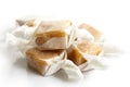 Pile of luxury wrapped caramel toffees in perspective. Royalty Free Stock Photo