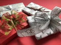 Pile of luxury wrapped Christmas gifts on a red background Royalty Free Stock Photo