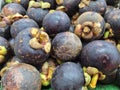 pile of mangosteens or known as Garcinia mangostana, photographed at a high angle