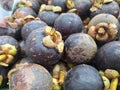 pile of mangosteens or known as Garcinia mangostana, photographed at a high angle