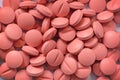 Pile of many light pink hard pills
