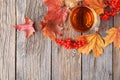 Pile maple leaves in corner of wooden background