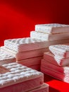 A pile of mattresses on a red background Royalty Free Stock Photo