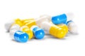 Pile of medical yellow pills and blue pills Royalty Free Stock Photo