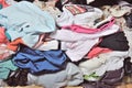 Pile of messy clothes in closet. Untidy cluttered woman. Royalty Free Stock Photo