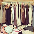 Pile of messy clothes in closet. Untidy cluttered woman wardrobe Royalty Free Stock Photo