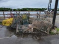 pile of metal lobster traps on dock near water Royalty Free Stock Photo