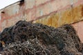 pile of metal swarf on dirty concrete wall background, close-up