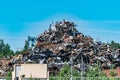 A pile of metal waste in the open air collected for recycling. Scrap metal on recycling site